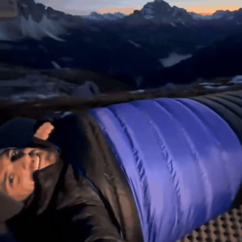 Blue sleeping bag beneath a starry sky